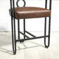 Callan - Set of 2 - 24" Dark Brown PU Bar Stools with Round Cushions, Curved Backrest, and Modern Black Metal Frame